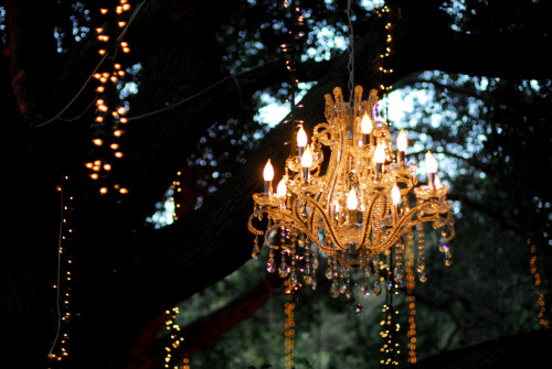 I big puffy heart the idea of using a chandelier outside for a wedding
